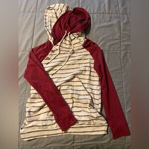 Double hood, size large, cream with red accent stripes, red sleeves.